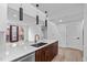 Modern open concept kitchen featuring stainless steel appliances, a center island, and pendant lights at 615 W Peace St # 406, Raleigh, NC 27605