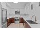 Modern kitchen featuring a stainless steel refrigerator and a sleek, stainless steel sink at 615 W Peace St # 406, Raleigh, NC 27605