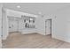 Bright, open living space with hardwood flooring and a view to the building's exterior at 615 W Peace St # 406, Raleigh, NC 27605