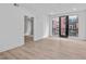 Bright living room space featuring hardwood flooring, large windows, and contemporary finishes at 615 W Peace St # 406, Raleigh, NC 27605