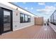 Rooftop deck with wood-look flooring and private screened area, perfect for outdoor enjoyment at 615 W Peace St # 406, Raleigh, NC 27605