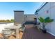 Entertain on this spacious rooftop deck with dining table and bar stools at 615 W Peace St # 406, Raleigh, NC 27605