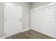 Hallway with sleek horizontal-slatted accent wall and coat hooks at 624 Gateway Crossing Ln, Wake Forest, NC 27587