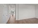 Bright living room with wood-look flooring, and view into the kitchen at 6453 Alfalfa Ln, Wake Forest, NC 27587