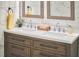 Bathroom featuring double vanity, white marble countertops, and modern fixtures at 723 Holloway St, Durham, NC 27701