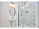 Contemporary bathroom with sleek glass shower and stylish pedestal sink at 723 Holloway St, Durham, NC 27701