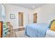 Cozy bedroom showcasing natural light and an open doorway to a modern bathroom at 723 Holloway St, Durham, NC 27701