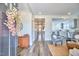 Warm foyer with wood floors, natural light, and open sight-lines to kitchen and living spaces at 723 Holloway St, Durham, NC 27701