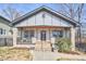 Charming craftsman-style home with stone accents, a covered porch, and a welcoming entrance at 723 Holloway St, Durham, NC 27701