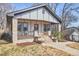 Lovely home featuring stone porch columns, a cozy porch, and appealing curb appeal at 723 Holloway St, Durham, NC 27701