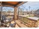 Relaxing front porch with stone supports, views of the neighborhood and comfortable seating at 723 Holloway St, Durham, NC 27701