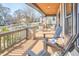 Spacious front porch featuring wood ceilings, stone supports and cozy seating at 723 Holloway St, Durham, NC 27701