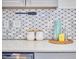 Close-up of a kitchen detail featuring sleek countertops, modern backsplash, and stylish accessories, showcasing functionality at 723 Holloway St, Durham, NC 27701