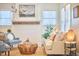 Bright living room with a decorative fireplace, comfortable seating, stylish furnishings, and plenty of natural light at 723 Holloway St, Durham, NC 27701