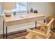 Bright desk with modern decor and hardwood chair in front of window at 723 Holloway St, Durham, NC 27701
