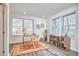 Bright home office with hardwood floors, two large windows, and modern decor at 723 Holloway St, Durham, NC 27701