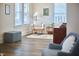 Bright sitting area with comfortable chairs, stylish rug, and a view of the neighborhood, perfect for relaxing at 723 Holloway St, Durham, NC 27701