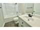 Bathroom featuring a shower and bathtub combination, toilet, and sink with mirror at 73 Grace Pond Ave, Benson, NC 27504