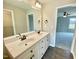 Bathroom featuring a double sink vanity with dark wood accents and modern fixtures at 73 Grace Pond Ave, Benson, NC 27504