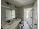 Well-lit bathroom with double sink vanity, modern fixtures and a neutral color palette at 73 Grace Pond Ave, Benson, NC 27504