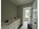 Bathroom featuring a double sink vanity and a separate toilet and shower area at 73 Grace Pond Ave, Benson, NC 27504
