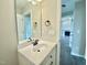 Bathroom featuring white vanity, framed mirror, and modern fixtures at 73 Grace Pond Ave, Benson, NC 27504