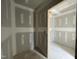 Unfinished bathroom leading to another room at 73 Grace Pond Ave, Benson, NC 27504