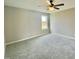 Neutral-toned bedroom featuring plush carpeting and a bright window at 73 Grace Pond Ave, Benson, NC 27504