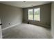 Bright bedroom with two windows letting in ample natural light, ready to be personalized at 73 Grace Pond Ave, Benson, NC 27504