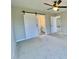 Bedroom featuring a barn door to the bathroom at 73 Grace Pond Ave, Benson, NC 27504