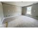 Bedroom offers natural light from a window and fresh paint waiting for your personal touch at 73 Grace Pond Ave, Benson, NC 27504