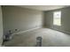 A bedroom featuring neutral paint on the walls, one window, and trim ready for the finishing touches at 73 Grace Pond Ave, Benson, NC 27504