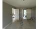 Bedroom featuring doorways, and a modern sliding barn door with black hardware at 73 Grace Pond Ave, Benson, NC 27504