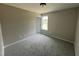 Cozy bedroom with soft carpeting and a window offering natural light, freshly painted at 73 Grace Pond Ave, Benson, NC 27504