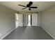 Spacious bedroom with ceiling fan, neutral carpet, and access to ensuite bathroom at 73 Grace Pond Ave, Benson, NC 27504
