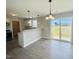 Dining area with breakfast bar and sliding glass door to the backyard at 73 Grace Pond Ave, Benson, NC 27504