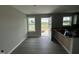 Dining room featuring a door leading outside and two windows to let in natural light at 73 Grace Pond Ave, Benson, NC 27504