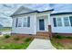 Close-up of single-story home with a covered porch, gray shutters, and brick accents at 73 Grace Pond Ave, Benson, NC 27504
