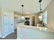 Kitchen with white cabinets, granite countertops, and stainless steel appliances at 73 Grace Pond Ave, Benson, NC 27504