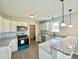Kitchen with white cabinets, granite countertops, and stainless steel appliances at 73 Grace Pond Ave, Benson, NC 27504