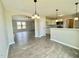 Open concept kitchen and living room with wood floors at 73 Grace Pond Ave, Benson, NC 27504
