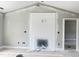 Spacious living room boasts high ceilings and a modern fireplace with shiplap at 73 Grace Pond Ave, Benson, NC 27504