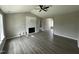Bright living room with vaulted ceiling, modern fireplace, and stylish flooring at 73 Grace Pond Ave, Benson, NC 27504