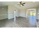 Spacious living room with a vaulted ceiling and wood floors at 73 Grace Pond Ave, Benson, NC 27504