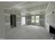 Unfinished living room with natural light and a fireplace at 73 Grace Pond Ave, Benson, NC 27504