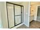 Shower with sliding glass doors and a sleek, modern design at 73 Grace Pond Ave, Benson, NC 27504