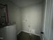Compact utility room features water heater, connections and access panel at 73 Grace Pond Ave, Benson, NC 27504