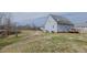 Spacious backyard view showcases the rear of the home and the surrounding landscape at 802 N Fifth St, Mebane, NC 27302