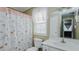 Bathroom featuring a shower with a floral curtain at 802 N Fifth St, Mebane, NC 27302