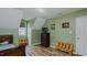 Bedroom with wood floors and a small TV atop a tall dresser at 802 N Fifth St, Mebane, NC 27302